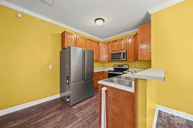 a kitchen with a refrigerator sink and microwave