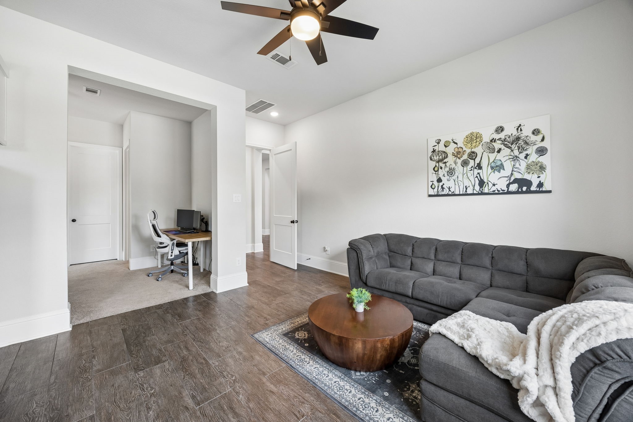 10102 South Goshawk Trail Conroe, TX 77385 - Photo 27 of 46 a living room with furniture and a couch