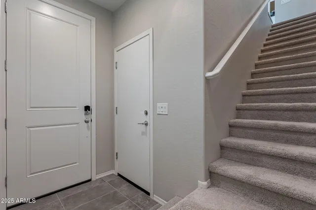a view of entryway with bedroom and stairs