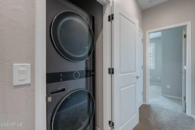 a view of a bathroom with a washer and dryer