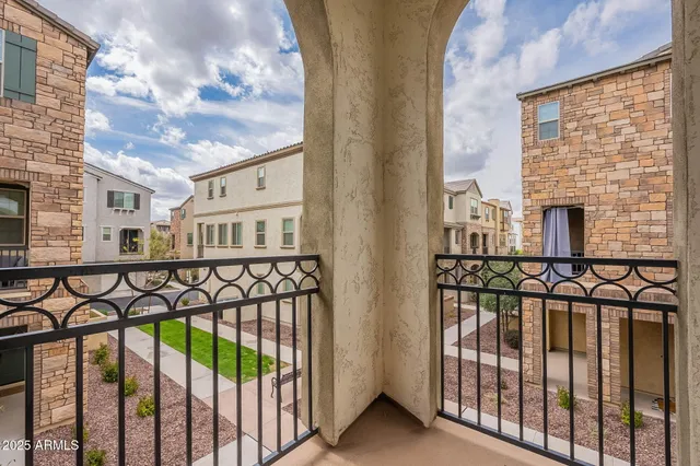 a view of a balcony with wooden fence