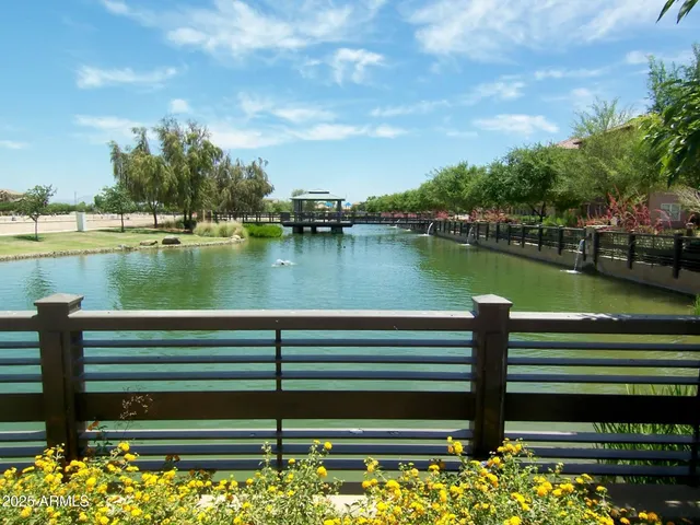 a view of a lake with a bench and a lake view