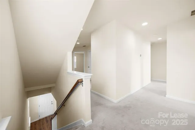 a view of a hallway with staircase