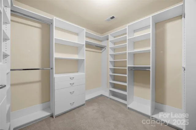 a view of an empty walk in closet