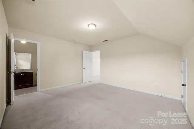 an empty room with a bathroom