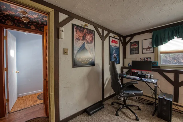 a workspace with furniture and a window