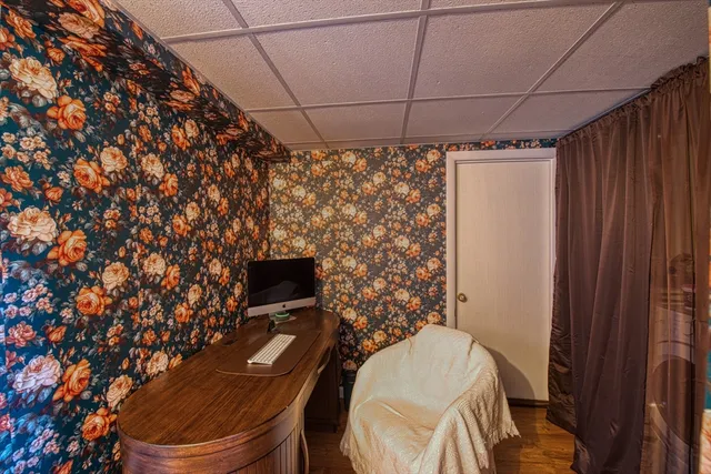 a bathroom with a toilet and a shower curtain