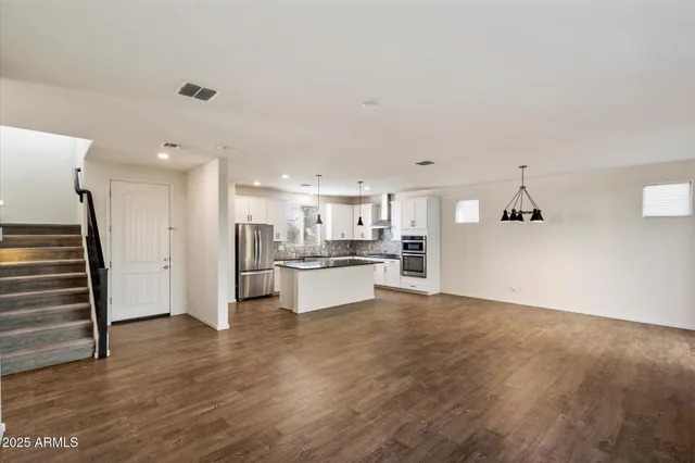 a view of kitchen with wooden floor