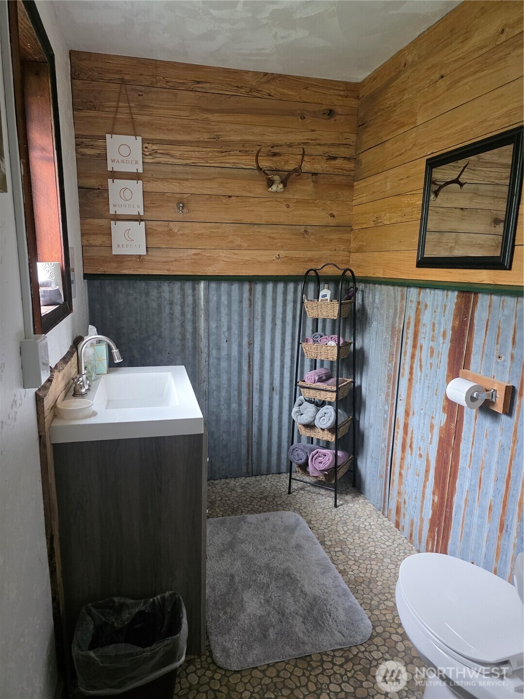 540 Nichols Road Clallam Bay, WA 98326 - Photo 14 of 25 a bathroom with a sink toilet and shower