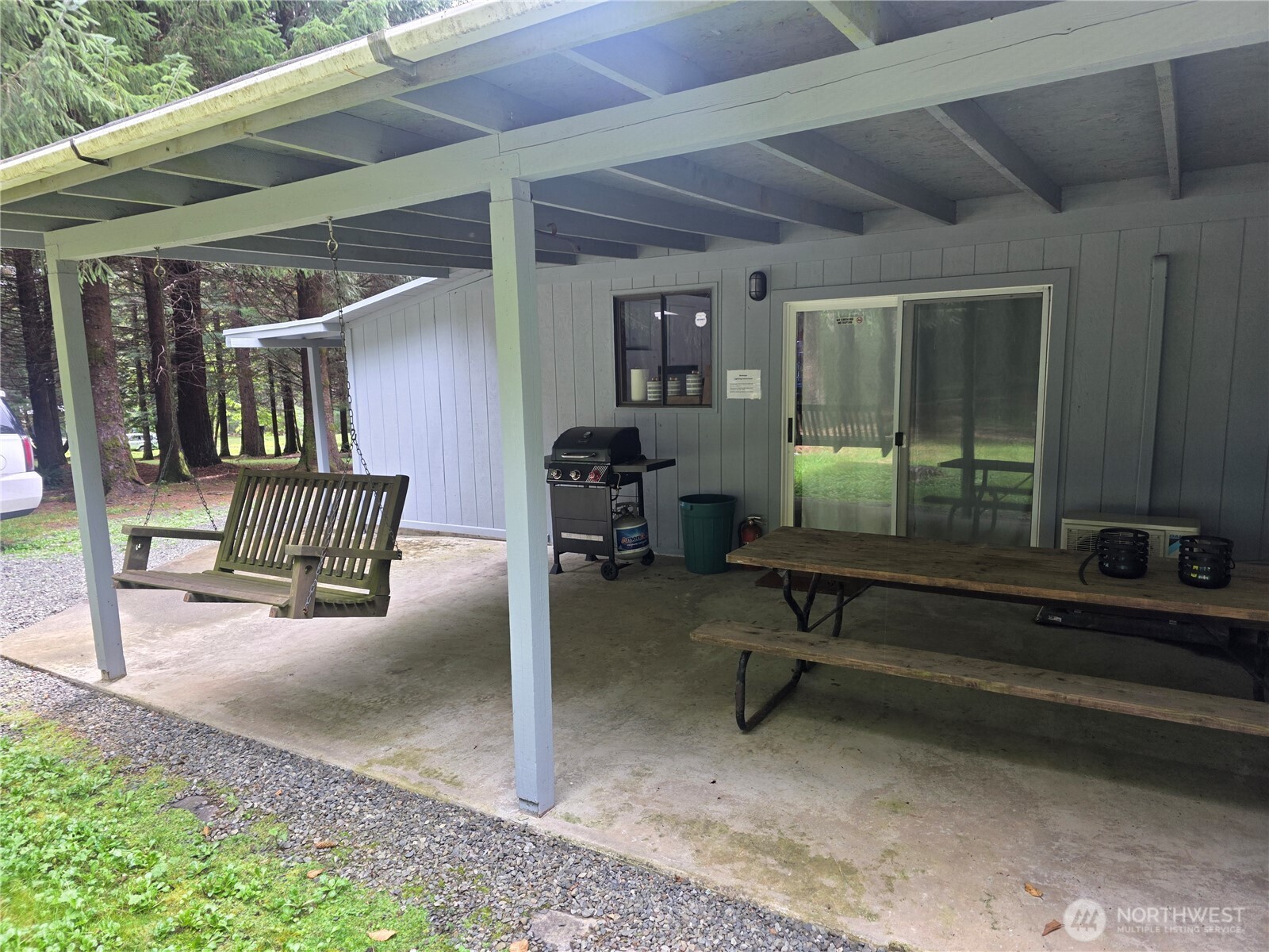 540 Nichols Road Clallam Bay, WA 98326 - Photo 20 of 25 a building outdoor space with patio furniture and potted plants