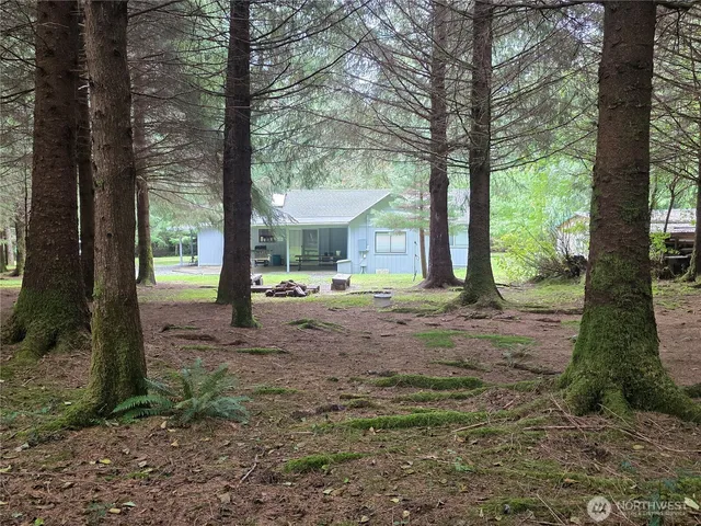 a backyard of a house with lots of green space