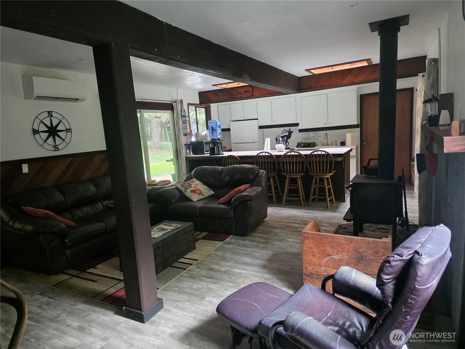 540 Nichols Road Clallam Bay, WA 98326 - Photo 5 of 25 a living room with furniture a ceiling fan and a rug