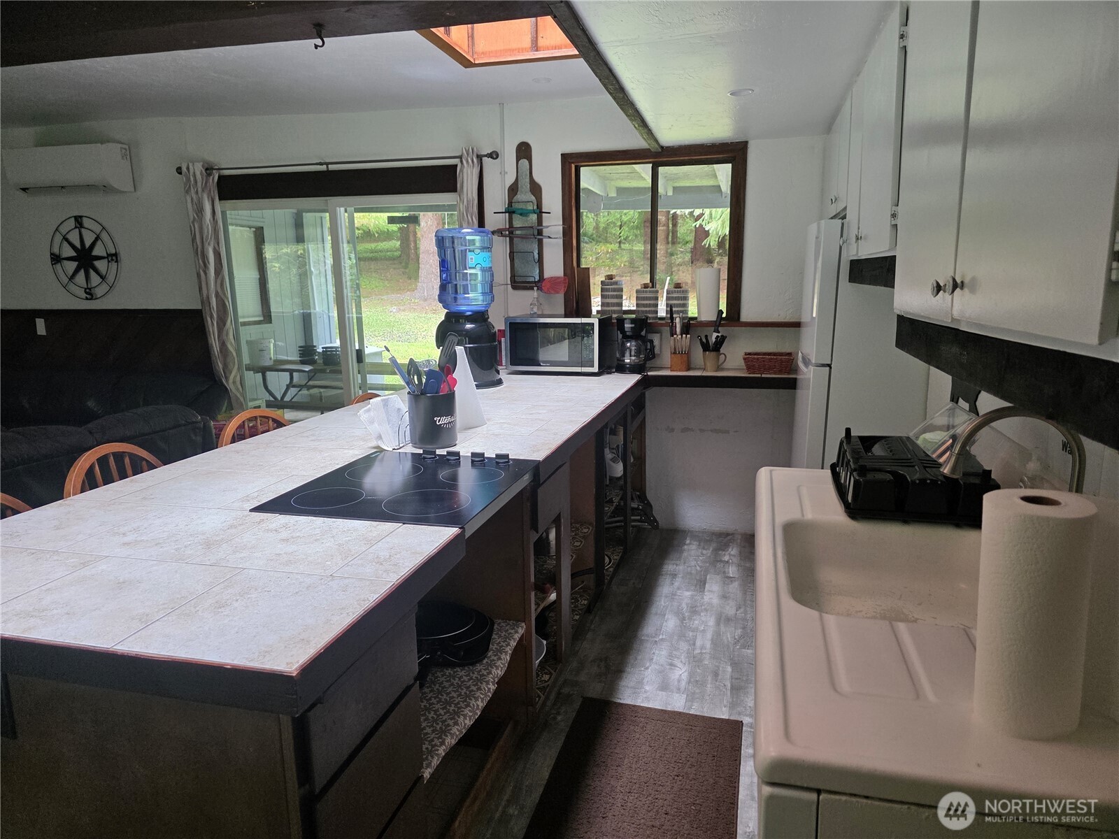 540 Nichols Road Clallam Bay, WA 98326 - Photo 8 of 25 a kitchen with sink and refrigerator