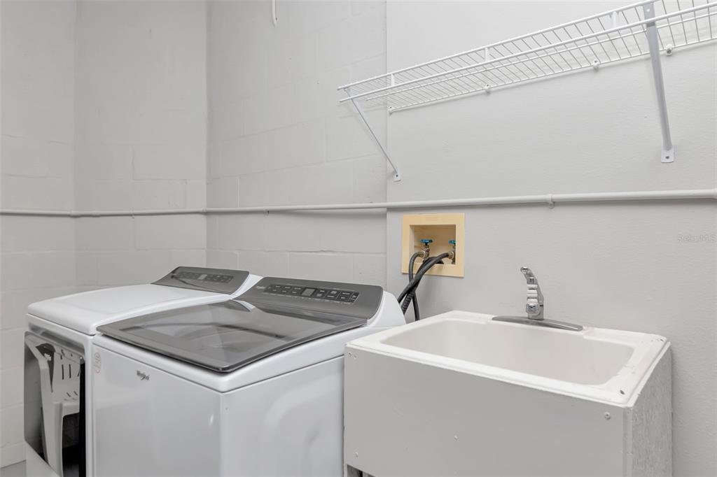 9500 Green Needle Drive New Port Richey, FL 34655 - Photo 13 of 28 a utility room with dryer and washer