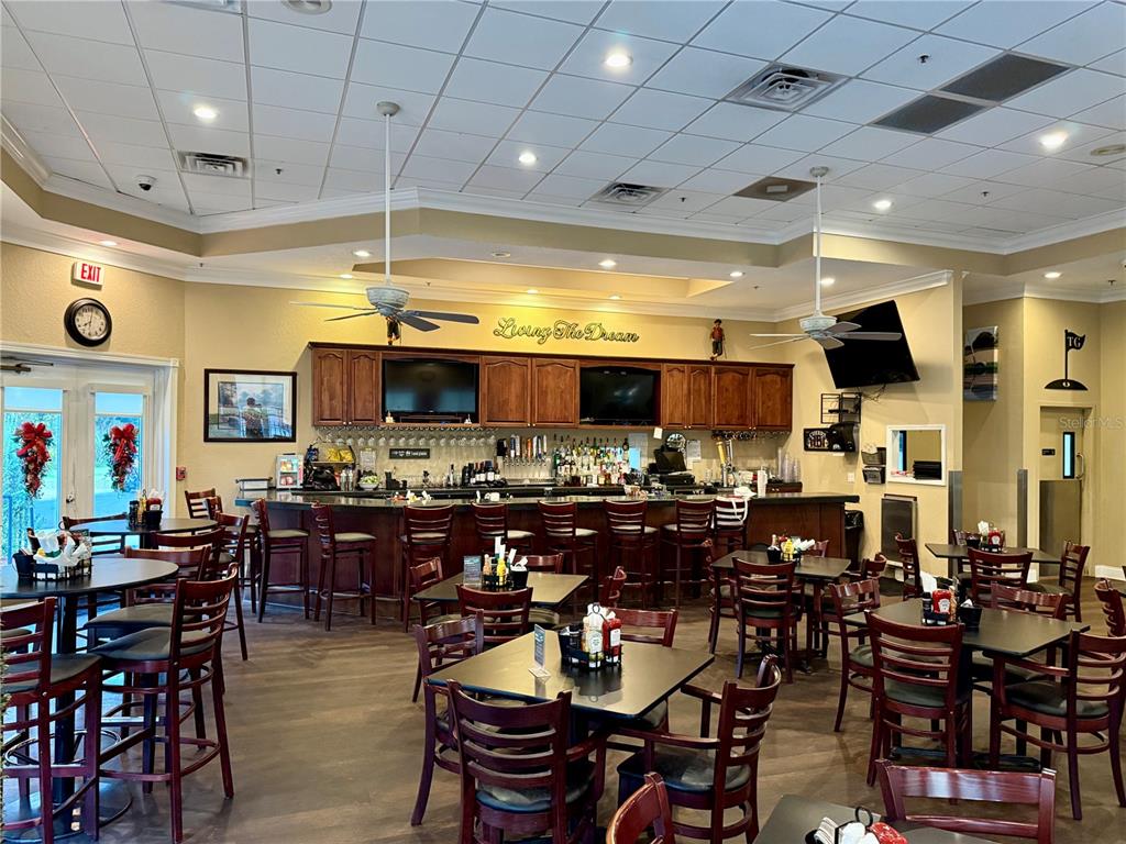 9500 Green Needle Drive New Port Richey, FL 34655 - Photo 26 of 28 a view of a dining area with furniture