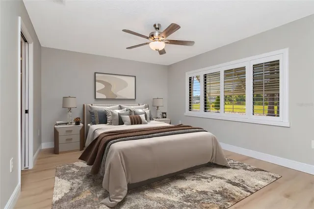 a bed room with bed and window