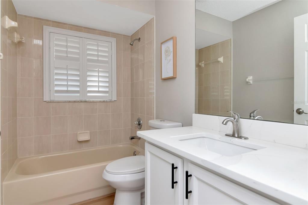 9500 Green Needle Drive New Port Richey, FL 34655 - Photo 10 of 28 a bathroom with a sink a toilet and shower