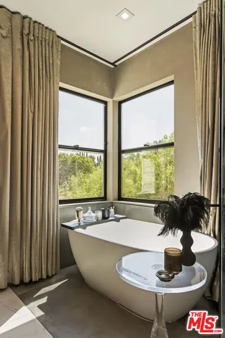 a dining room with a large window and table