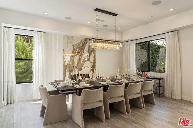 a dining room with furniture window wooden floor