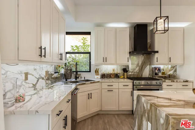 a kitchen with a sink stove and cabinets