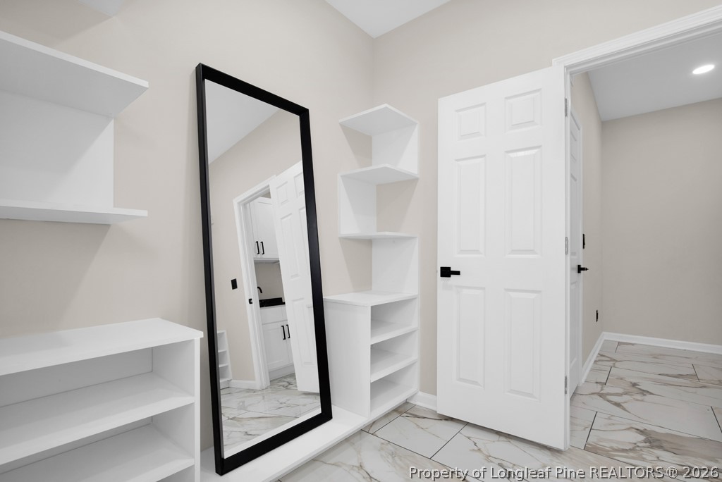 3025 Old Stage Road South Erwin, NC 28339 - Photo 25 of 50 a bathroom with a glass shower door and a mirror