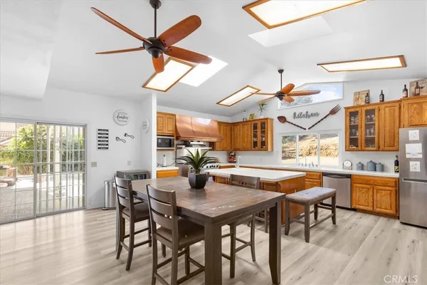 a kitchen with stainless steel appliances granite countertop a stove and a microwave