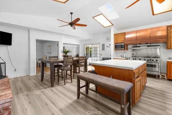 a kitchen with wooden cabinets and a refrigerator