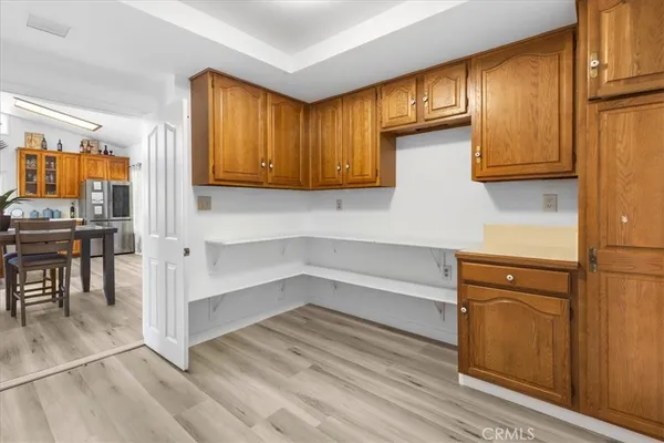 a view of walk in closet with wooden floor