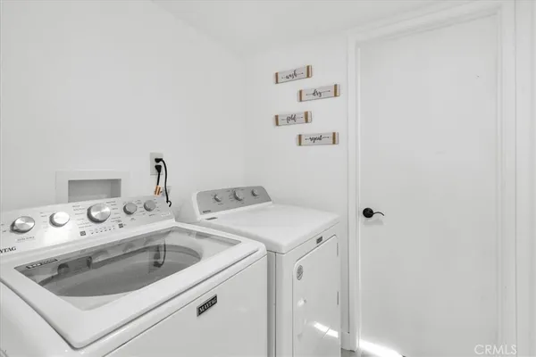a bathroom with a shower sink vanity mirror and toilet