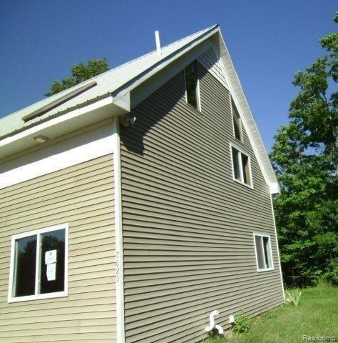 7629 Hency Road Kingsley, MI 49649 - Photo 2 of 7 71447940 Rear view.jpg