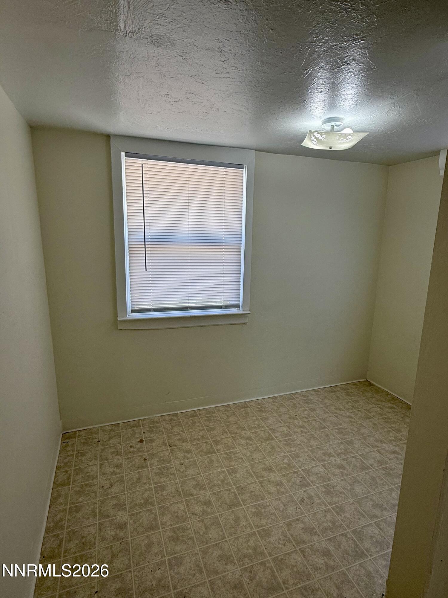 745 West Center Street Fallon, NV 89406 - Photo 8 of 31 an empty room with a empty space and windows