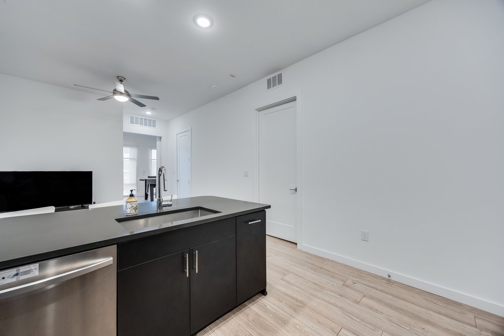 4801 Springdale Road, Unit 2107 Austin, TX 78723 - Photo 6 of 26 a kitchen with a sink and a mirror