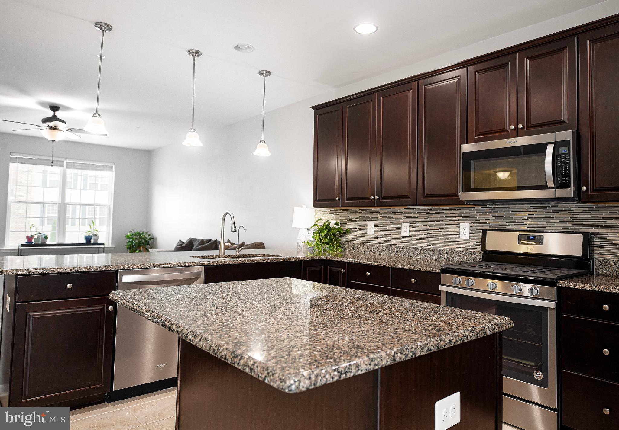 913 Morgan Run Road Middle River, MD 21220 - Photo 12 of 46 Kitchen with dark wood cabinetry