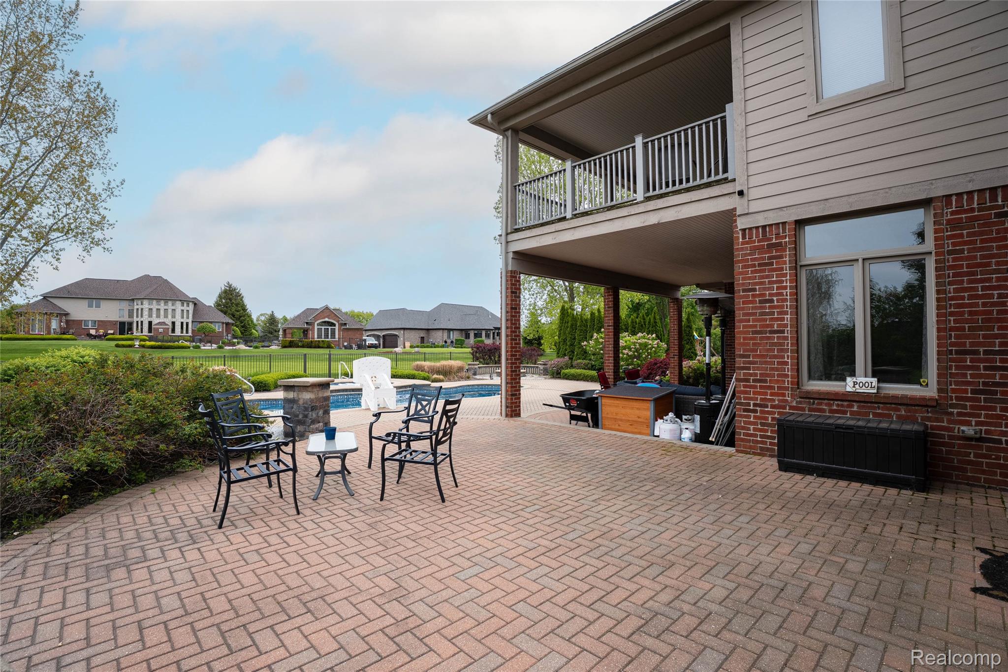 67102 Rachael Lane Washington, MI 48095 - Photo 7 of 37 Patio / terrace featuring a patio area, an outdoor pool, and a residential view