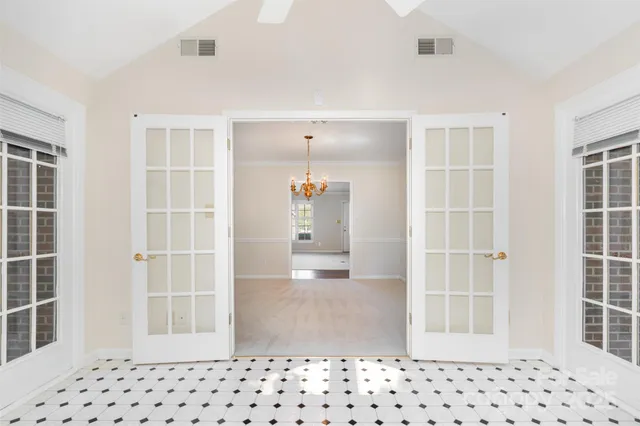 a view of a house with patio and a yard