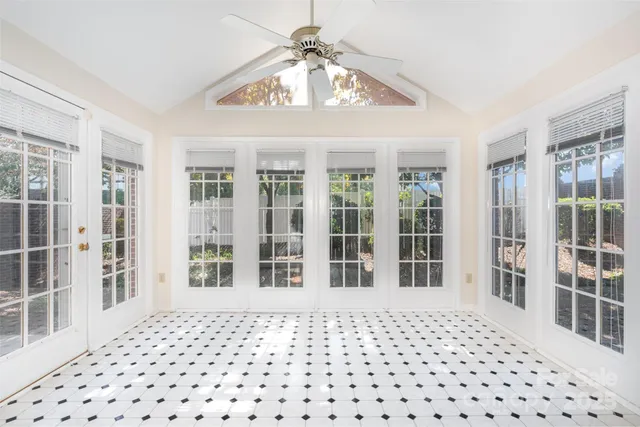 a view of a house with backyard sitting area and garden