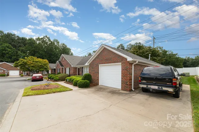 a view of a car parked in front of a house
