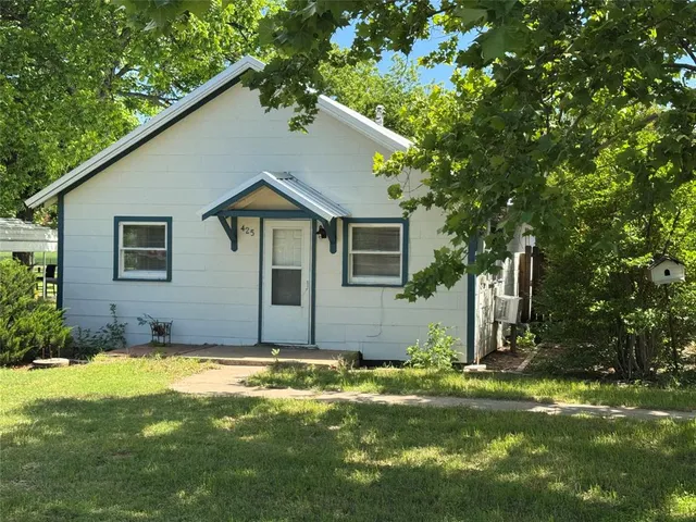a house view with a garden space