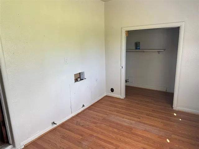 a view of hallway with wooden floor