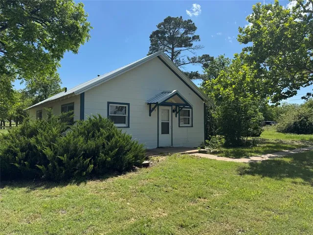 a house with trees in the background