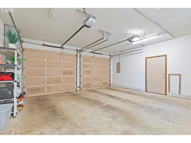 a view of empty room with stairs and chandelier