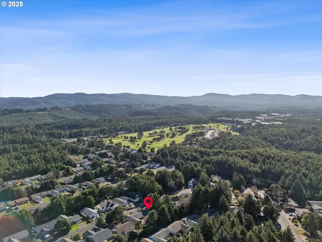an aerial view of residential house with outdoor space