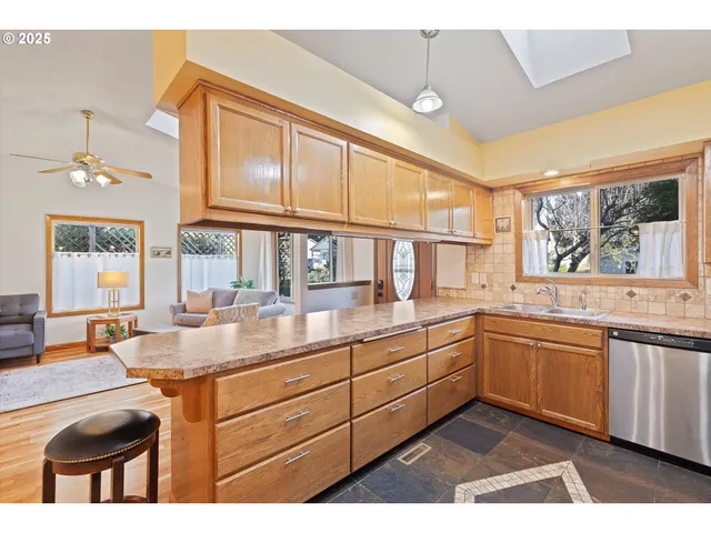 a kitchen with sink and cabinets