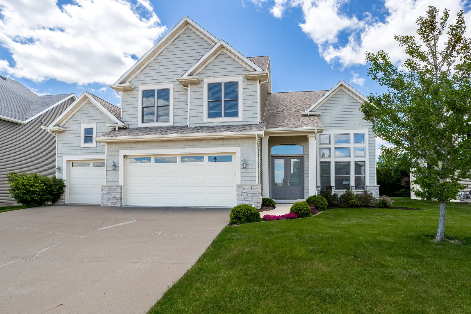 5700 Emily Road Bettendorf, IA 52722 - Photo 58 of 58 a front view of house with yard and green space