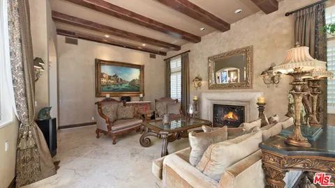 a kitchen with stainless steel appliances chandelier and refrigerator