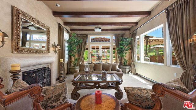 a view of a swimming pool with a garden and plants