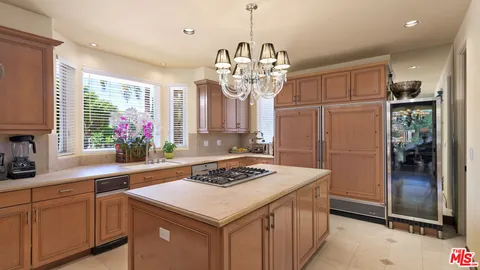 a patio with patio a table and chairs under an umbrella