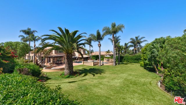 a view of a swimming pool with lounge chair