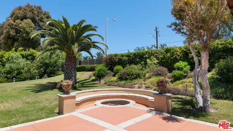 a bedroom with a large bed and a large window