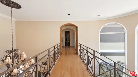 a spacious bathroom with a double vanity sink a large mirror a shower and bathtub